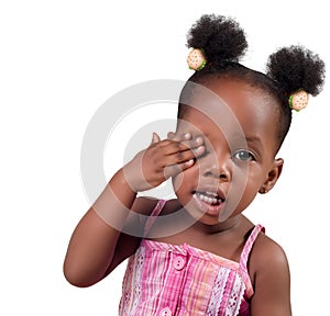 Little girl covering eye