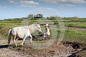 Little girl with cowboy hat and pony