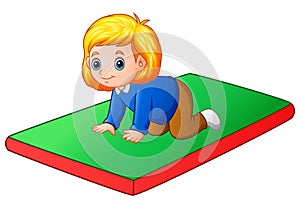 Little girl crawling on the mat