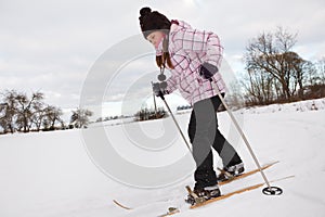 Little girl cross-country skiing