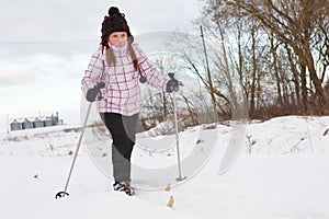 Little girl cross-country skiing