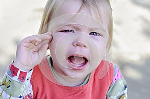 Little girl crying and offended.