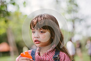 Little girl crying in park.