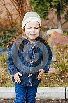 Little girl crying on the street. Hurt and tears of kid