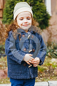 Little girl crying on the street. Hurt and tears of kid