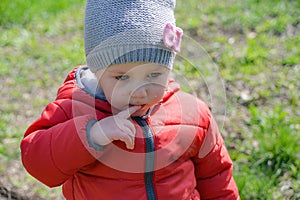 Little girl crying on the street walking in the park