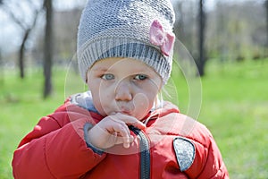 Little girl crying with tears on the street walking in the park