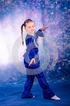 Little girl dancing in the blue costume