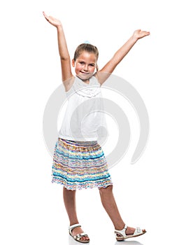 Little girl dancing hands up