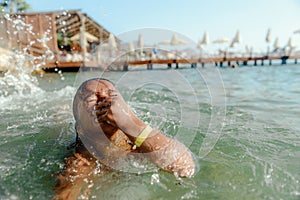 Little girl in danger drowning at the ocean