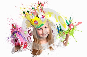 Little girl demonstrating her craft work, Easter bonnets and crown.. london