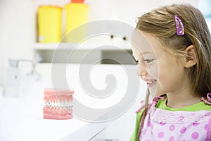 Little girl in dental office, smiling