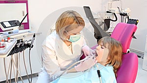 Little girl and dentist