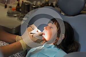 Little girl at a dentist examination