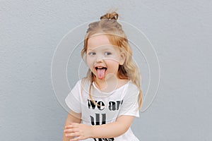 Little girl deride. Beautiful blond hair female child