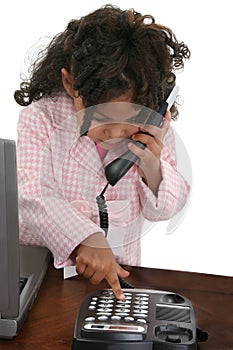 Little Girl Dialing Phone At Desk