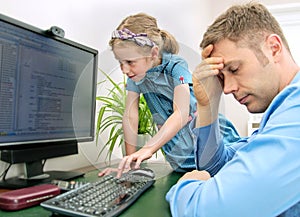 Little girl disturbing her dad.