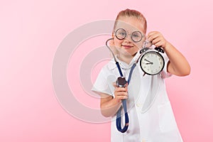 Little girl in doctor costume with clocks