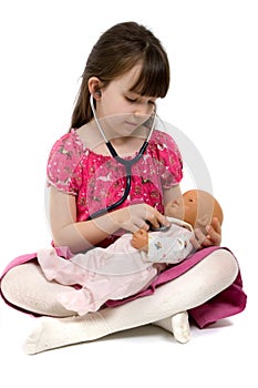 Little Girl Doctor With Stethoscope And Doll