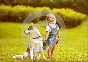 Little girl with a dog Husky