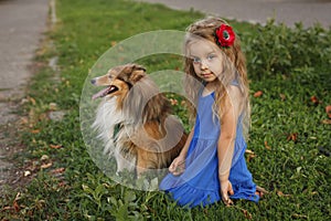 Little girl with a dog Sheltie