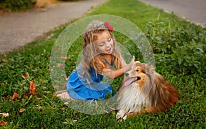 Little girl with a dog Sheltie