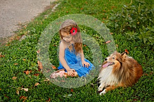 Little girl with a dog Sheltie