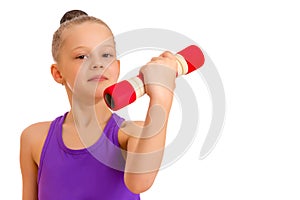 Little girl doing exercises with dumbbells.