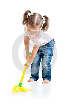 Little girl doing playing and mopping the floor