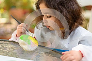 Little Girl Drawing On Stone Outdoors In Summer Sunny Day.