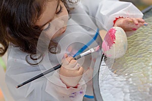 Little Girl Drawing On Stone Outdoors In Summer Sunny Day.