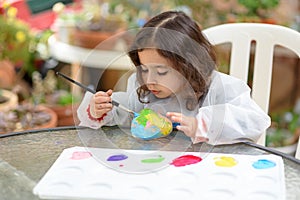 Little Girl Drawing On Stone Outdoors In Summer Sunny Day.