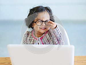 Little girl, dress up and laptop play business person fun, smile or laugh in fancy clothes. Toddler, glasses or office