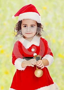 Little girl dressed as Santa Claus