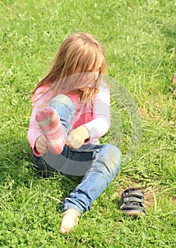 Little girl dressing up socks