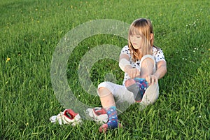 Little girl dressing up socks