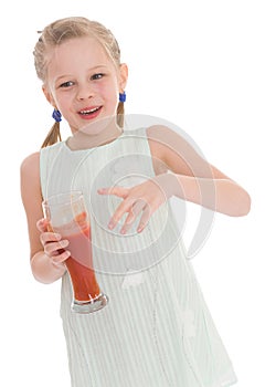 Little girl drink tasty red tomato juice
