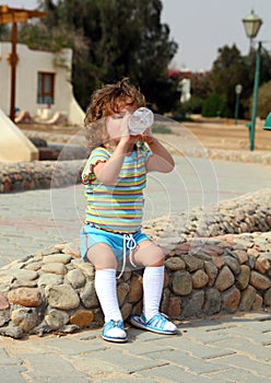Little girl drinking from bottle