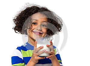 Little girl drinking a glass of milk