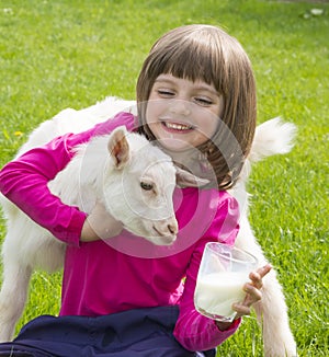 Little girl drinking healthy goat milk