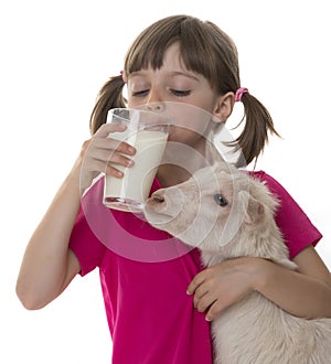 Little girl drinking healthy goat milk