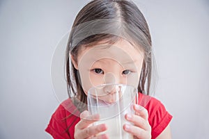 Little girl drinking milk