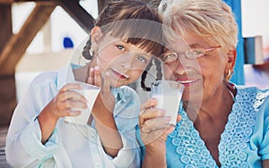 Little girl is drinking milk