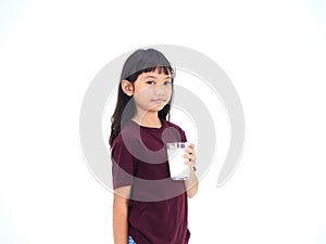 Little girl drinking milk on white background