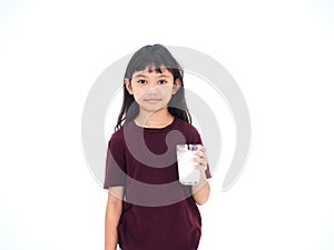 Little girl drinking milk on white background