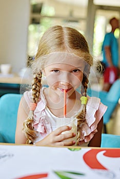 Little girl drinking milkshake