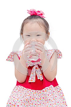 Little girl drinking water from glass