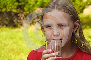 Little girl is drinking water