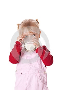 Little girl drinks milk