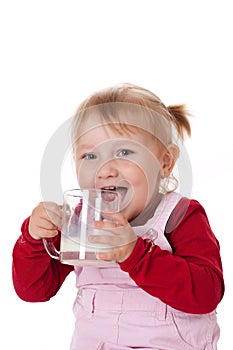 Little girl drinks milk